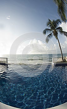 Infinity pool with float caribbean sea