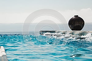 Infinity pool jacuzzi with azure water. Luxury lifestyle, spa concept.