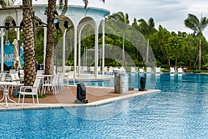 Infinity pool and lounge chairs in a luxury hotel