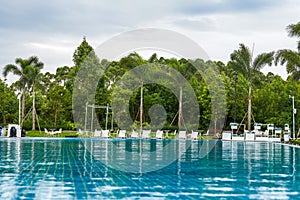 Infinity pool and lounge chairs in a luxury hotel