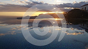 Infinity pool reflexion at sunset over Funchal Madeira Portugal