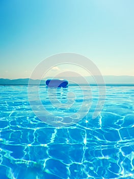 Infinity swimming pool with sea and Mountain View