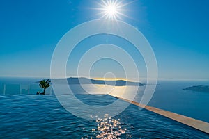 Infinity swimming pool water merges with Mediterranean Sea below