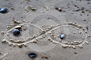 Infinity symbol drawing on sand. Close up