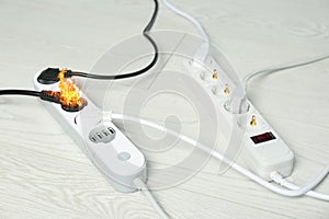 Inflamed plug in power board - electrical short circuit