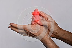 Inflammation of Asian man thumb and hand. Concept of cellulitis and finger problems photo