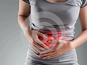 Inflammation of the intestines: a woman holds her inflamed stomach