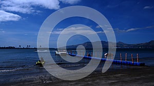 Inflatable blue floating dock used by watersports vacationers