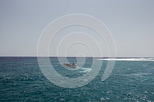 inflatable boat with lot of snorkeler at the red sea on vacation