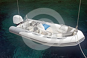 An inflatable boat on the super clean and clear Aegean sea