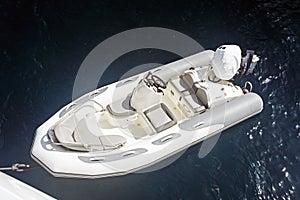 An inflatable boat on the super clean and clear Aegean sea