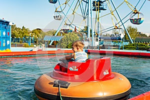 Inflatable boats for children on a water attraction in an extreme recreation park