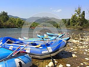 Inflatable boats with oars rafts for rafting along a mountain