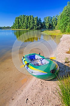 Inflatable dinghy at the summer lake