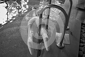 an inflatable doll abandoned in the swimming pool, indoor shot, no people