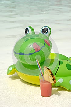 Inflatable frog on beach