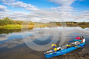 Inflatable kayak loaded tourist equipment