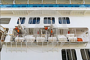 Inflatable liferafts in hard-shelled canisters on a passenger liner