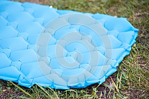 inflatable mat for comfortable and warm sleep in a tent camping in nature. Reliable reflection of cold and protection from