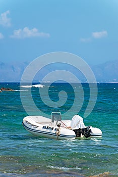 Inflatable motor boat on sea.