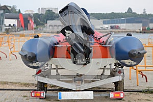 Inflatable motorboat on trailer close-up rear view