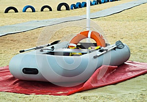 Inflatable Rescue Boat. Gray inflatable boat on the beach in the