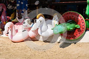 Inflatable rings with animals in a shop on the beach in Greece