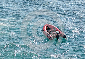 Inflatable rubber transport boat floating at sea