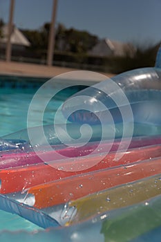 Inflatable tube floating in a swimming pool