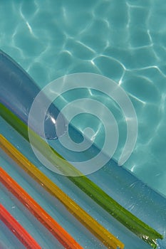 Inflatable tube floating in a swimming pool