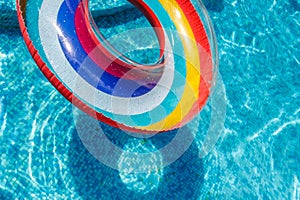 Inflatable water activities circles tuba float on the water in the pool. Concept, fun, perky summer and relaxation
