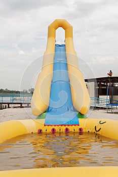 Inflatable water slide on the beach in summer