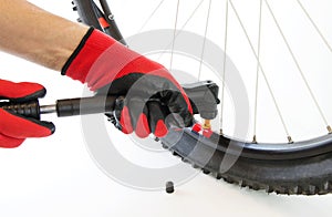 inflate a flat tire of a bicycle with a hand pump