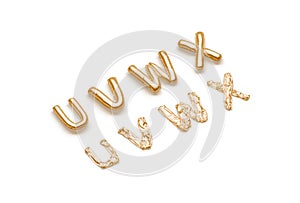Inflated, deflated gold U V W X letters, balloon font