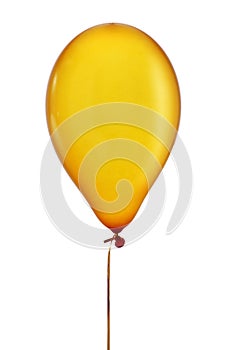 Inflated golden balloon in a string photo