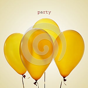Inflated golden balloons and word party, with a retro effect photo