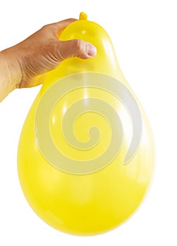 Inflated yellow balloon in hand isolated on white