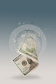 Inflation, hyperinflation, dollar stagflation. One hundred dollar bill sprayed on a blue background. The bill casts a