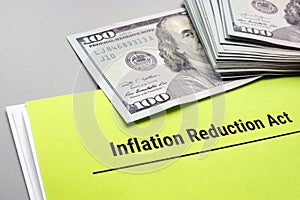 The Inflation Reduction Act of 2022 and cash on it. photo