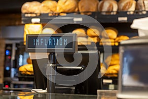 inflation sign at bakery cash register