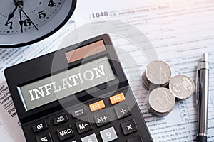 INFLATION word on calculator. Business and tax concept. Government, state taxes. Data analysis, paperwork, financial research,