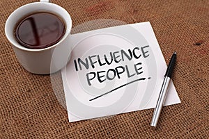 Influence people, text words typography written on paper against wooden background, life and business motivational inspirational