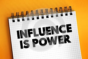 Influence is Power text on notepad, concept background