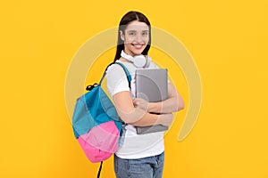 influencer blogging. cheerful girl with backpack and headphones.