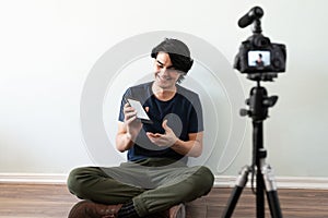 Video blogger recommending a book photo