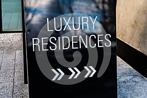 Info sign `luxury residences` on a street