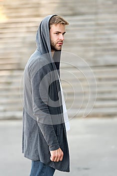 Informal style clothing. Fashionable young model man. Mystery man posing with hoodie. young street man with hood