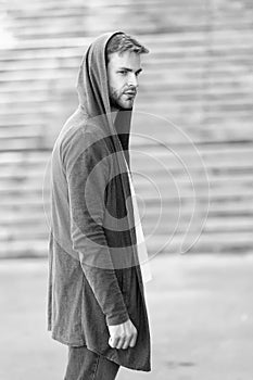 Informal style clothing. Fashionable young model man. Mystery man posing with hoodie. young street man with hood