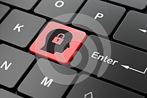 Information concept: Head With Padlock on computer keyboard background