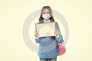 Information about coronavirus and quarantine. Child in mask hold open book. COVID-19 information